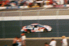 Jeff Burton flashes past in a blur of speed. Or the blur of the camraman's unsteady hands. You decide.